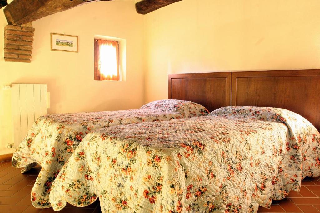 Letto o letti in una camera di Camere Zimmer Rooms San Francesco