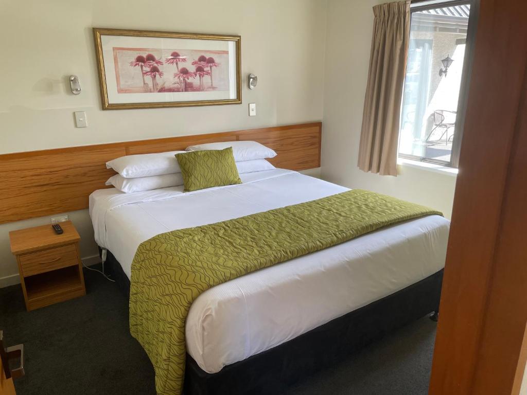 Postel nebo postele na pokoji v ubytování Allan Court Motel