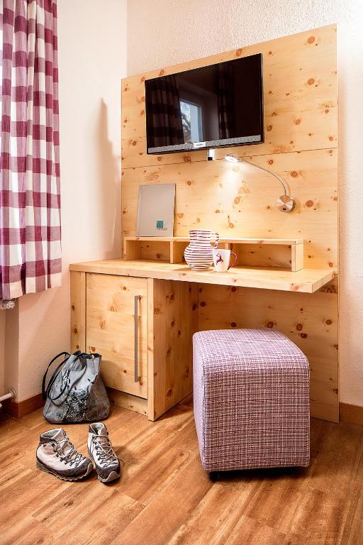 TV a/nebo společenská místnost v ubytování Hotel Wiedemann