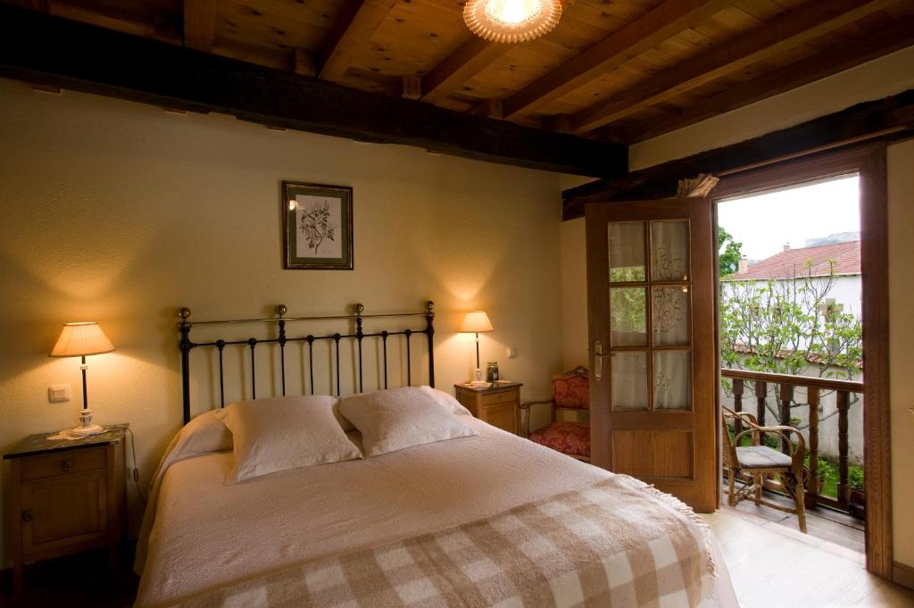 Postel nebo postele na pokoji v ubytování Posada El Prado Mayor