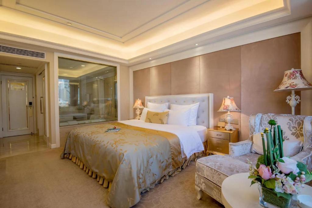 Postel nebo postele na pokoji v ubytování Panyu Hotel