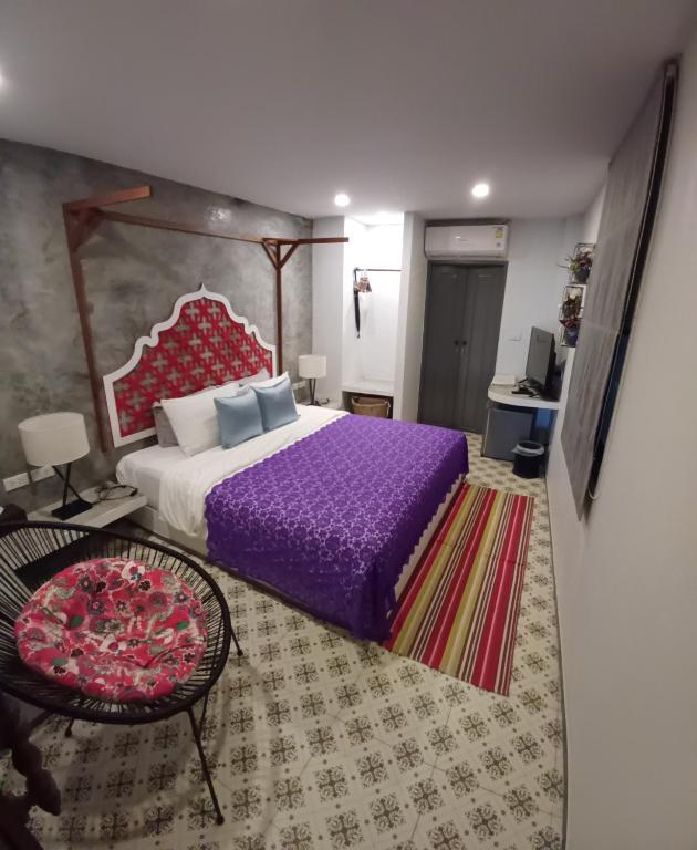 Postel nebo postele na pokoji v ubytování Mukrada House Boutique Hometel Krabi