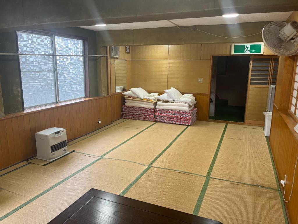 Postel nebo postele na pokoji v ubytování ふる里 Mt Fuji Inn Furusato
