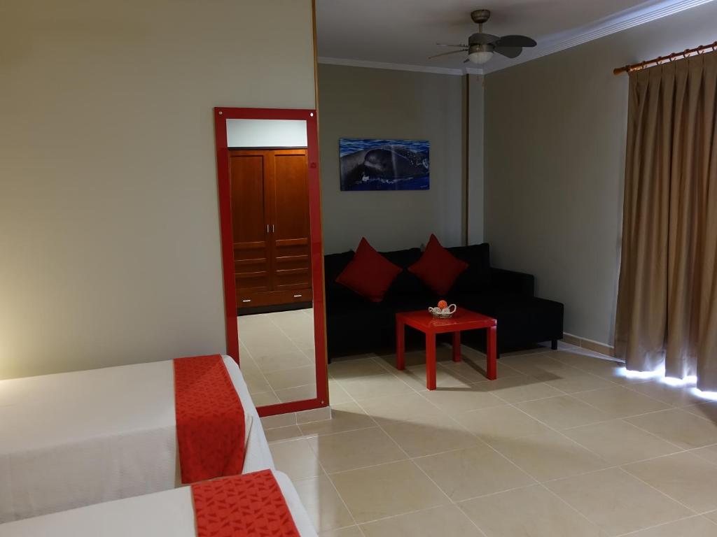 a living room with a couch and a table at Hotel Andrea´s in Los Cristianos