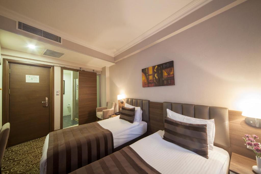Postel nebo postele na pokoji v ubytování Delta Hotel Istanbul & Old City