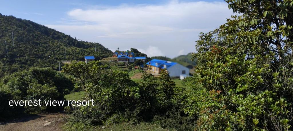 a house on top of a hill with trees at everest view resort in Jantra Khāni