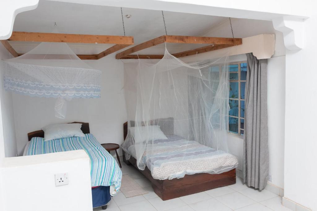 Postel nebo postele na pokoji v ubytování Sunnyside Inn