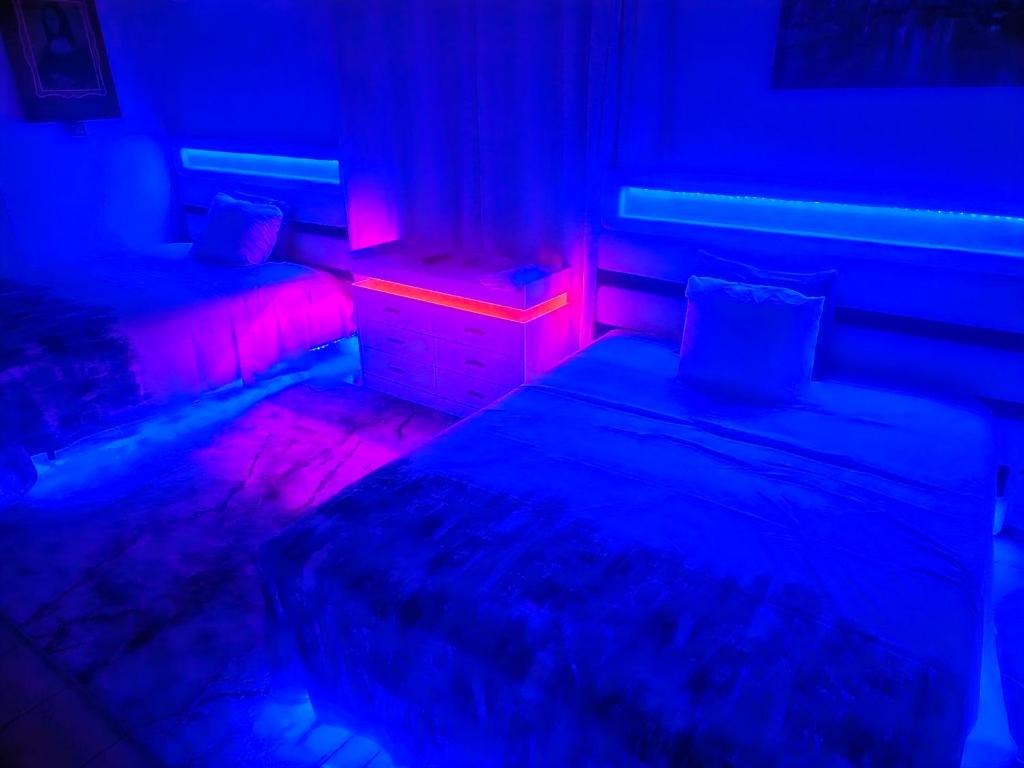 Postel nebo postele na pokoji v ubytování Big Apple Hotel