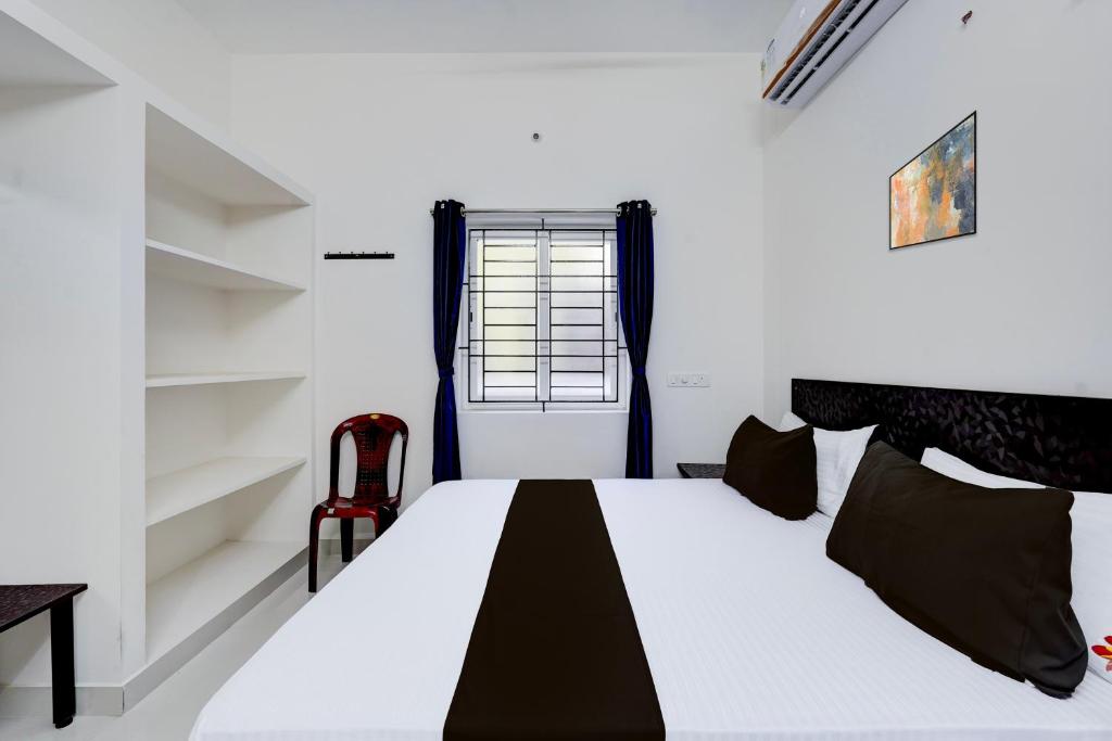 Postel nebo postele na pokoji v ubytování Hotel O Elegant Residency Vandalur Zoo
