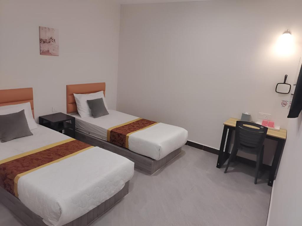 Postel nebo postele na pokoji v ubytování CMN Hotel & Homestay