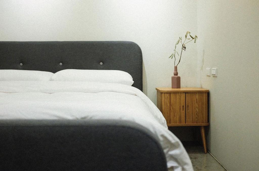 Postel nebo postele na pokoji v ubytování Hostel Tomato 番茄溫泉青旅
