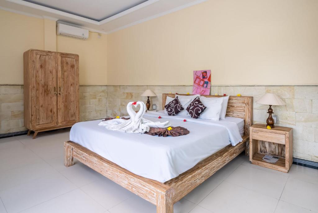 Postel nebo postele na pokoji v ubytování Yamuna Guest House