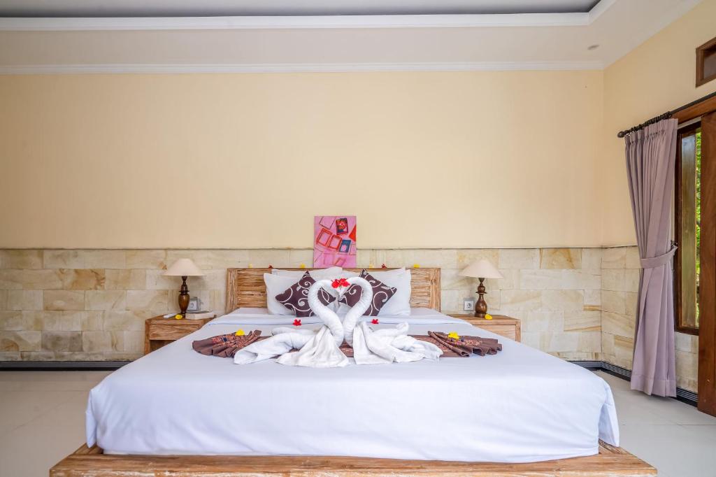 Postel nebo postele na pokoji v ubytování Yamuna Guest House