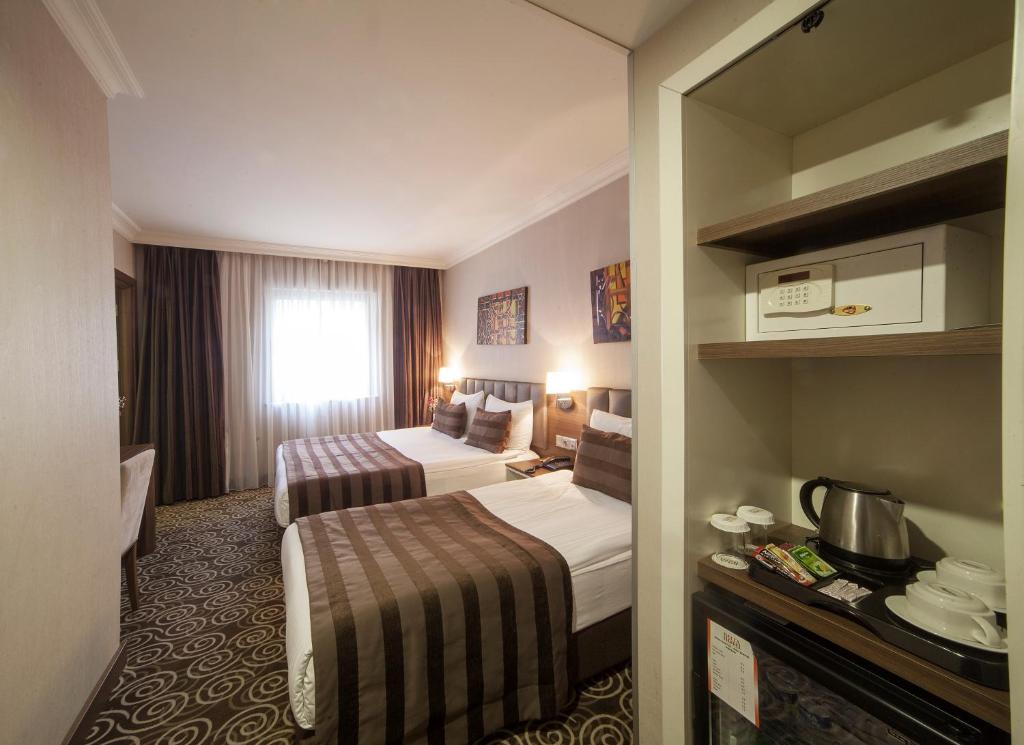 Postel nebo postele na pokoji v ubytování Delta Hotel Istanbul & Old City