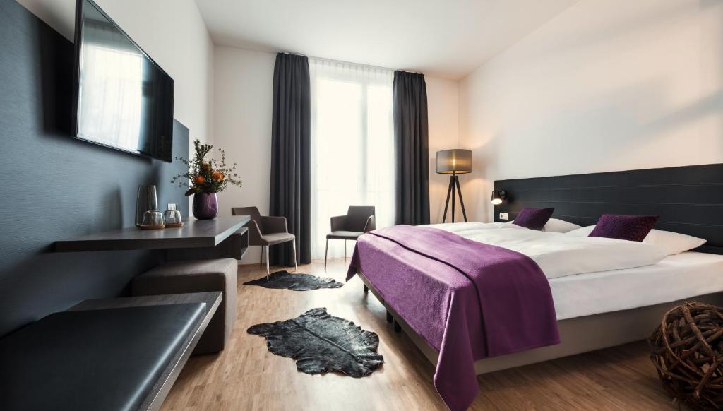 Postel nebo postele na pokoji v ubytování Hotel K99