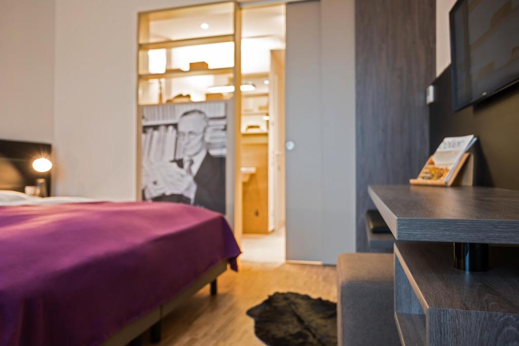 Postel nebo postele na pokoji v ubytování Hotel K99