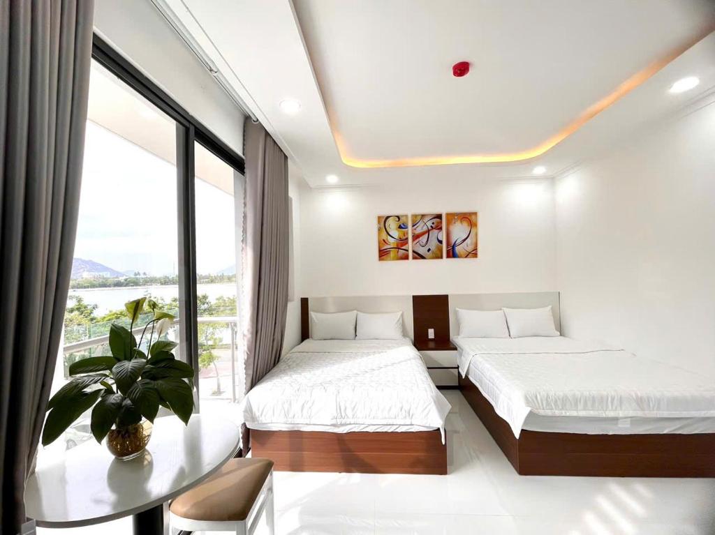 Postel nebo postele na pokoji v ubytování Hotel KAMI 1