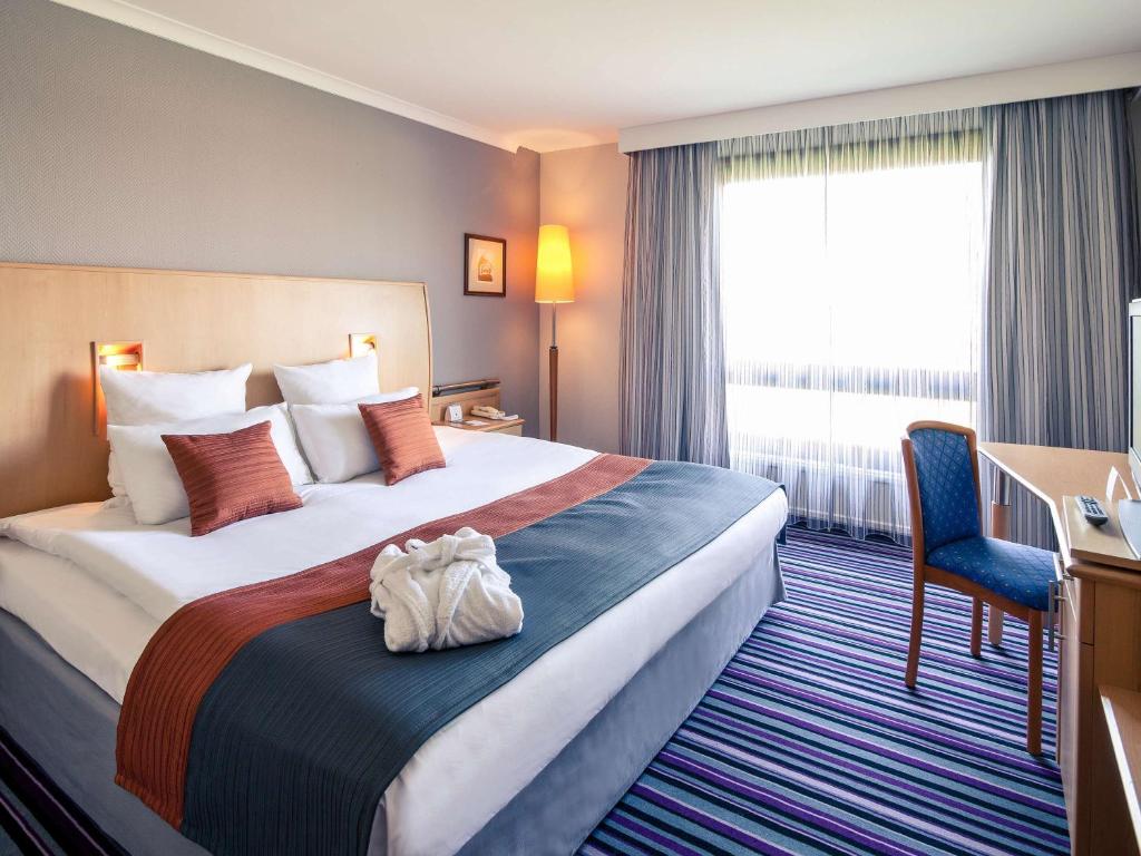 Posteľ alebo postele v izbe v ubytovaní Mercure Cieszyn