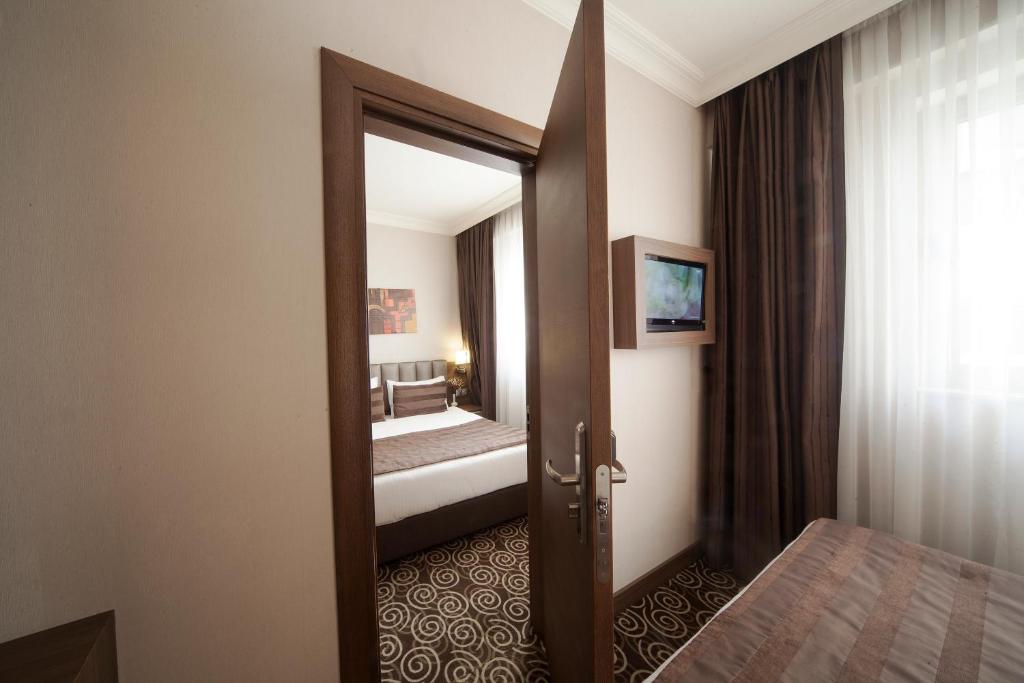 Postel nebo postele na pokoji v ubytování Delta Hotel Istanbul & Old City