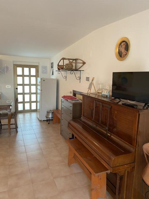 Telewizja i/lub zestaw kina domowego w obiekcie Casa vacanze Podere Bellavista