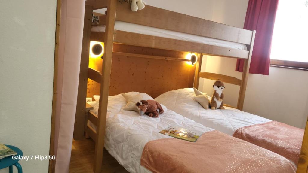 Postel nebo postele na pokoji v ubytování Appartement proche piste et près de l'Ecole de Ski