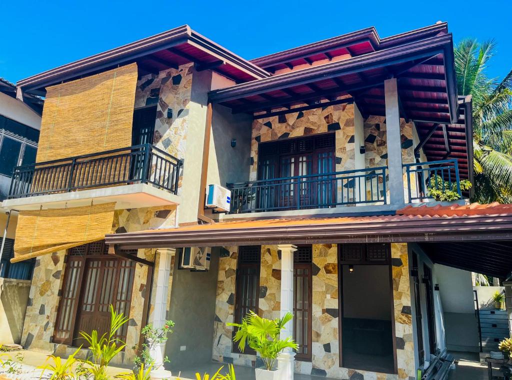 a building with balconies on the side of it at Villa Marbella Bliss in Tangalle