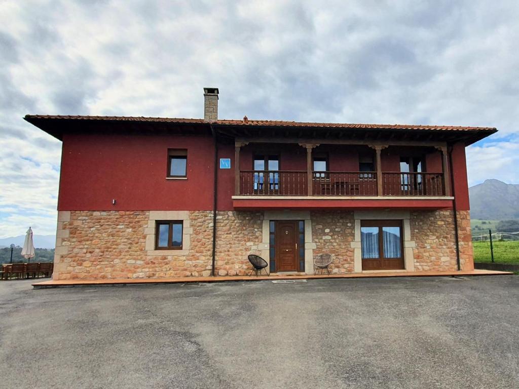 a large building with a balcony on top of it at La Bergerie del Uncal VV-2915-AS in Arriondas
