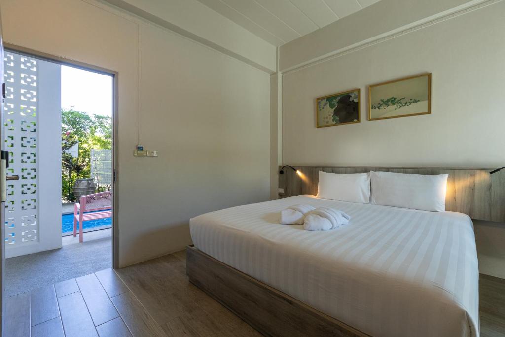 Postel nebo postele na pokoji v ubytování Ang Pao Hotel Phuket