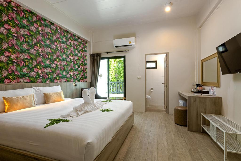 Postel nebo postele na pokoji v ubytování Ang Pao Hotel Phuket