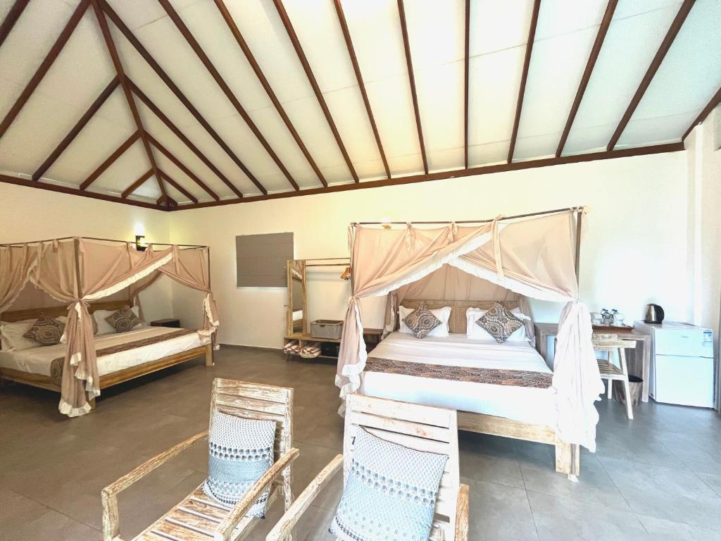 Postel nebo postele na pokoji v ubytování NIVADOO RESORT SIGIRIYA
