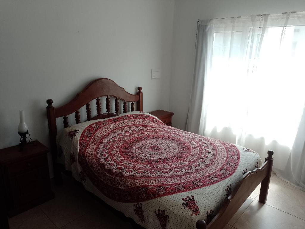 a bedroom with a bed and a window at Anita in Tandil