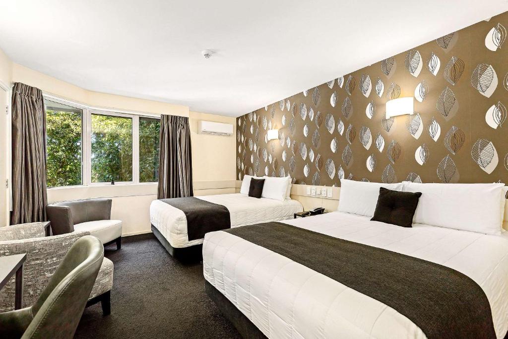 Postel nebo postele na pokoji v ubytování Hotel Elms Christchurch, Ascend Hotel Collection