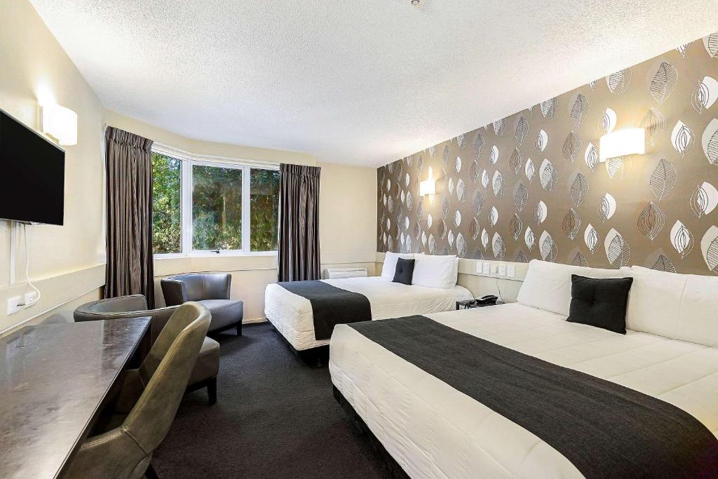 Postel nebo postele na pokoji v ubytování Hotel Elms Christchurch, Ascend Hotel Collection