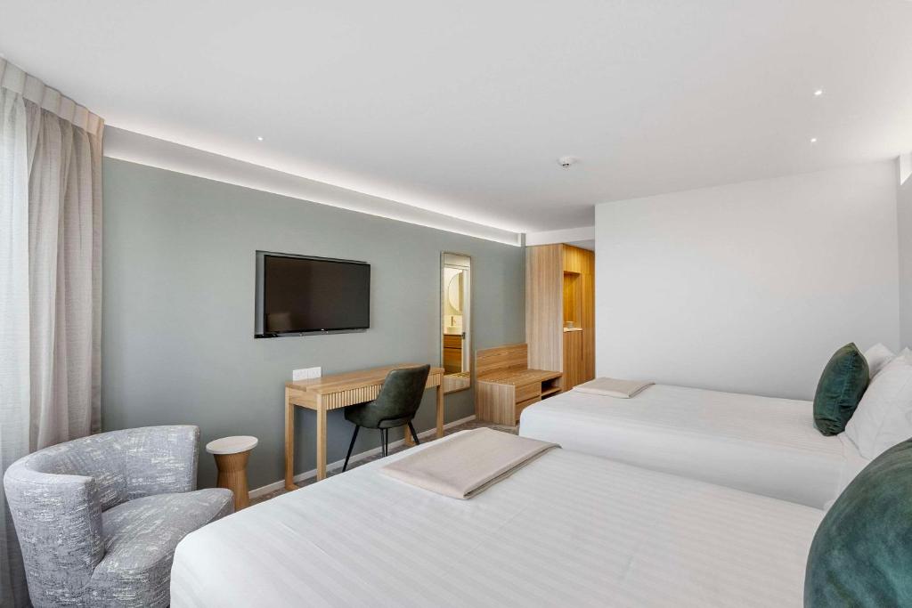 Postel nebo postele na pokoji v ubytování Hotel Elms Christchurch, Ascend Hotel Collection