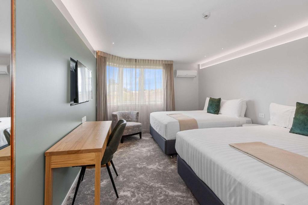 Postel nebo postele na pokoji v ubytování Hotel Elms Christchurch, Ascend Hotel Collection