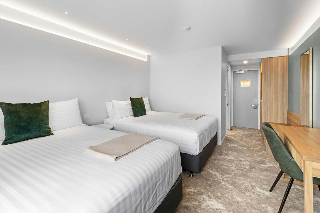 Postel nebo postele na pokoji v ubytování Hotel Elms Christchurch, Ascend Hotel Collection