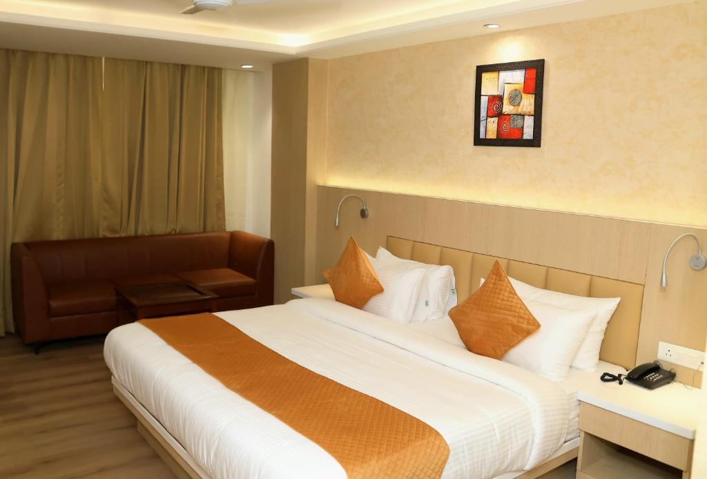 Postel nebo postele na pokoji v ubytování Hotel Radiance