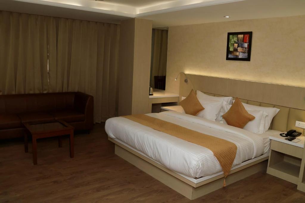 Postel nebo postele na pokoji v ubytování Hotel Radiance