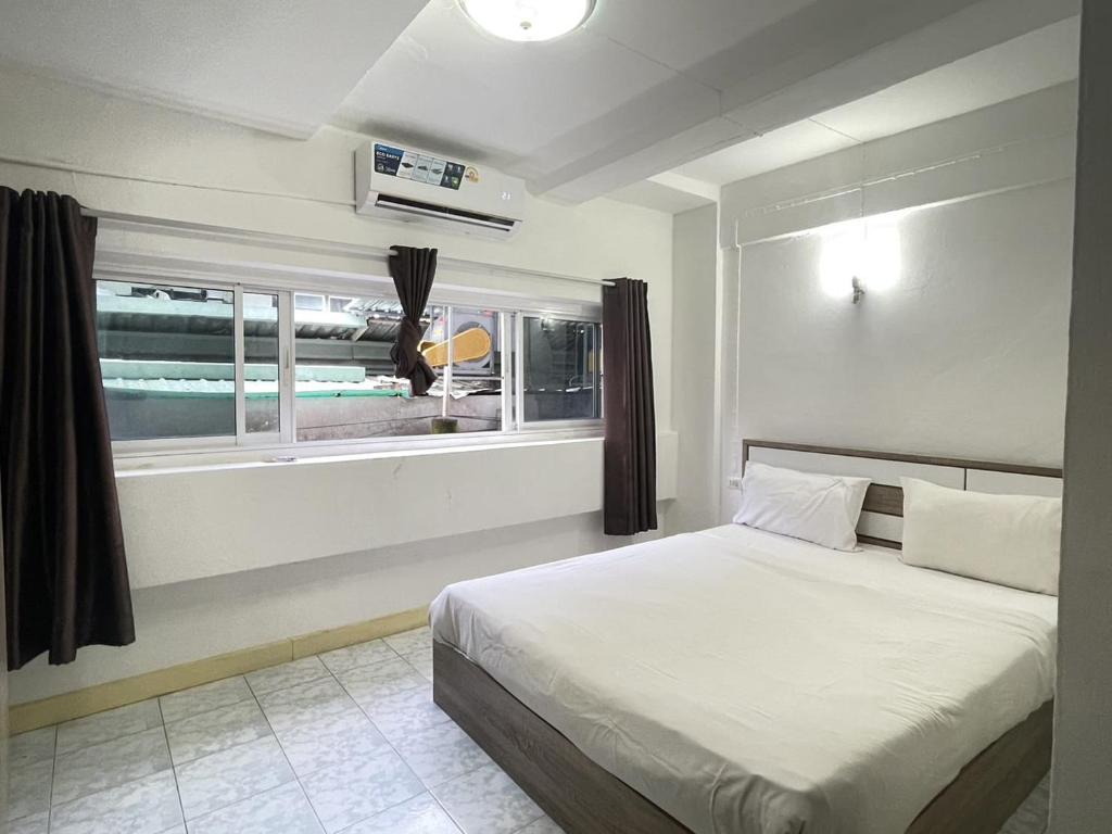 Katil atau katil-katil dalam bilik di Nice to CU Guest house