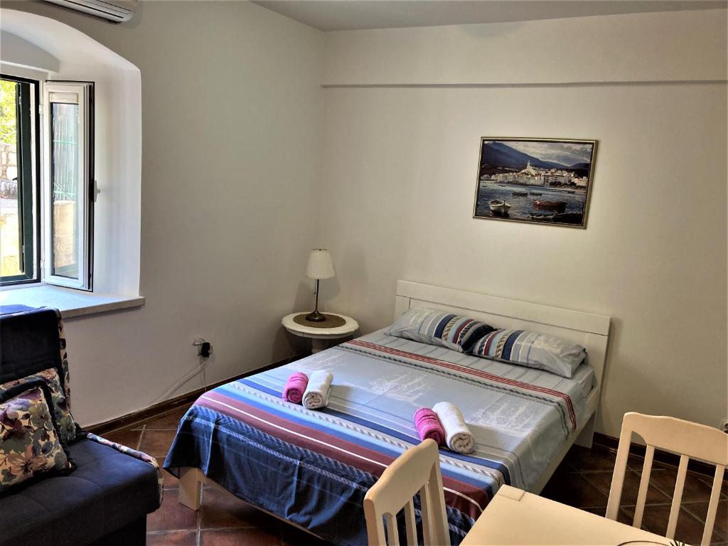 Postel nebo postele na pokoji v ubytování Villa Kamena
