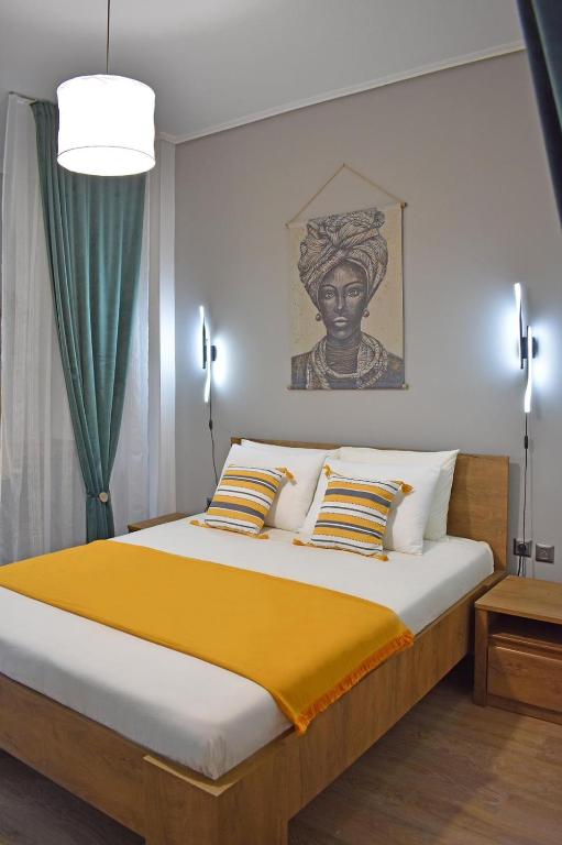 Postel nebo postele na pokoji v ubytování Maya Studio Piraeus