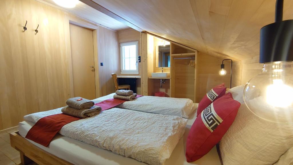 Postel nebo postele na pokoji v ubytování Naturfreunde Hostel Grindelwald