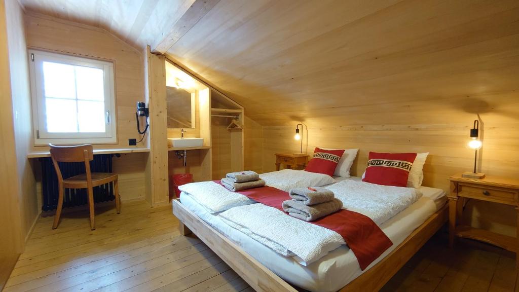 Postel nebo postele na pokoji v ubytování Naturfreunde Hostel Grindelwald