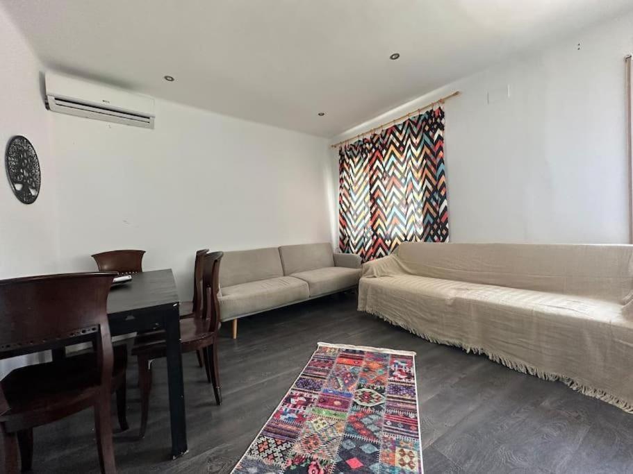 a living room with a couch and a table at Casa Vallromanes Rest House in Vallromanas