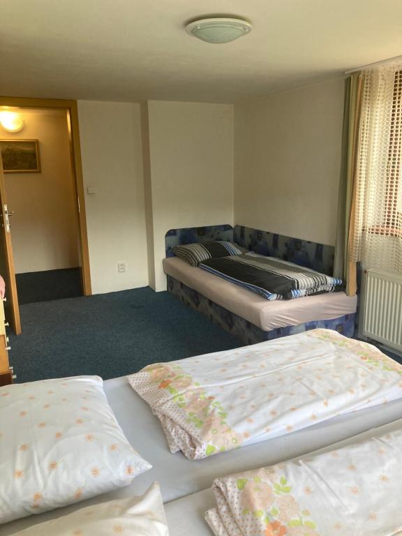 Postel nebo postele na pokoji v ubytování Apartmán u Bětky