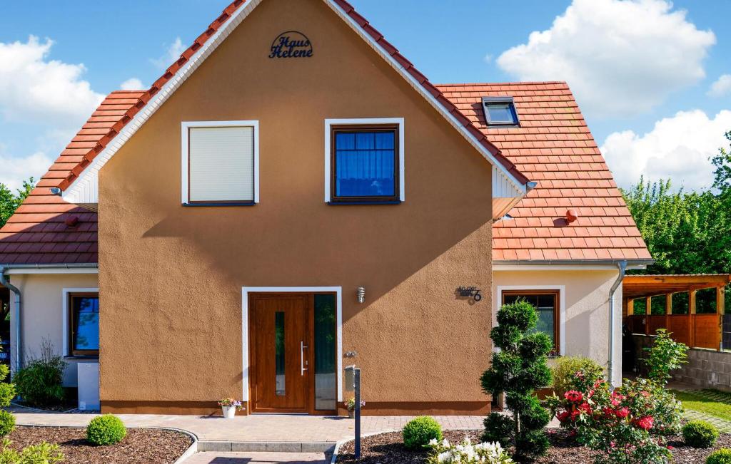 a house with a orange roof at Amazing Home In Klütz With Kitchen in Klütz