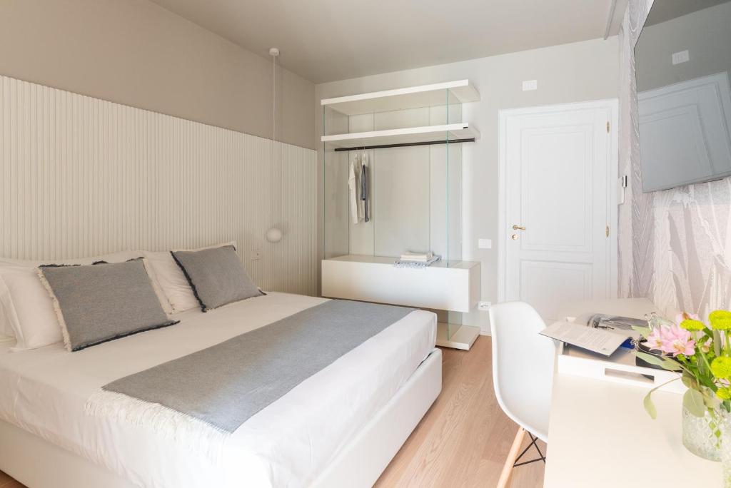 Postel nebo postele na pokoji v ubytování Dimora Bramante Rooms