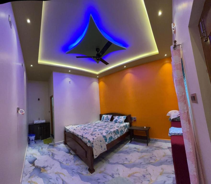 Comfortable hotel room interior at Hemanth Heritage Hotel, Hampi