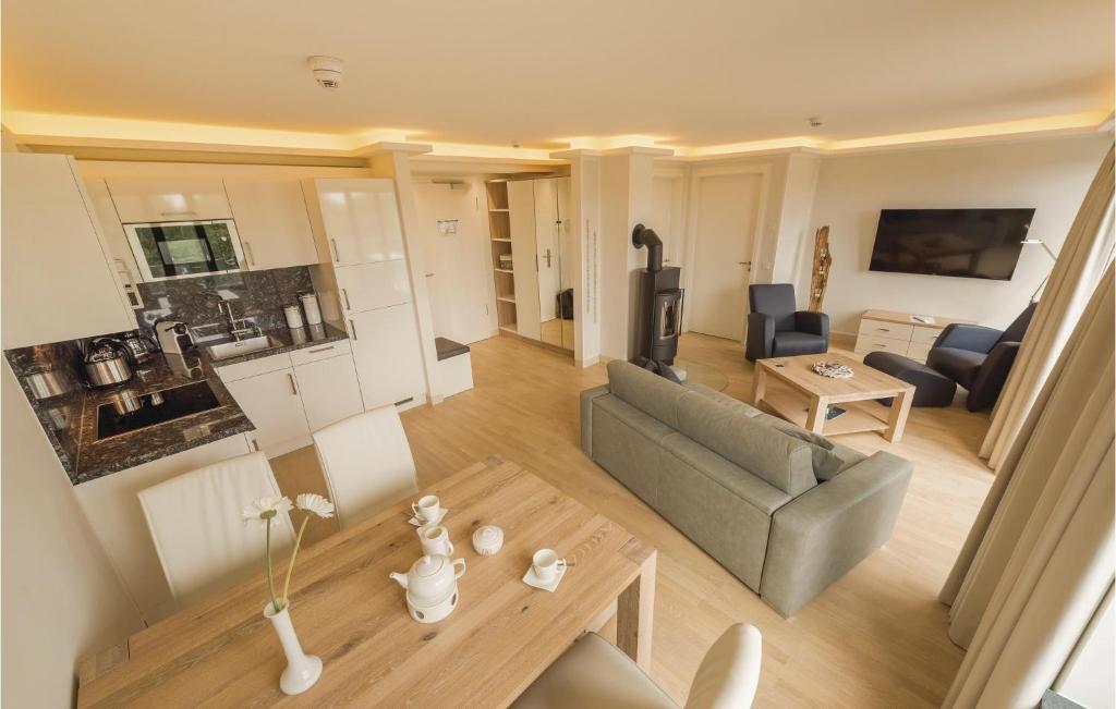 a living room with a couch and a table at Penthouse Cloud in Binz