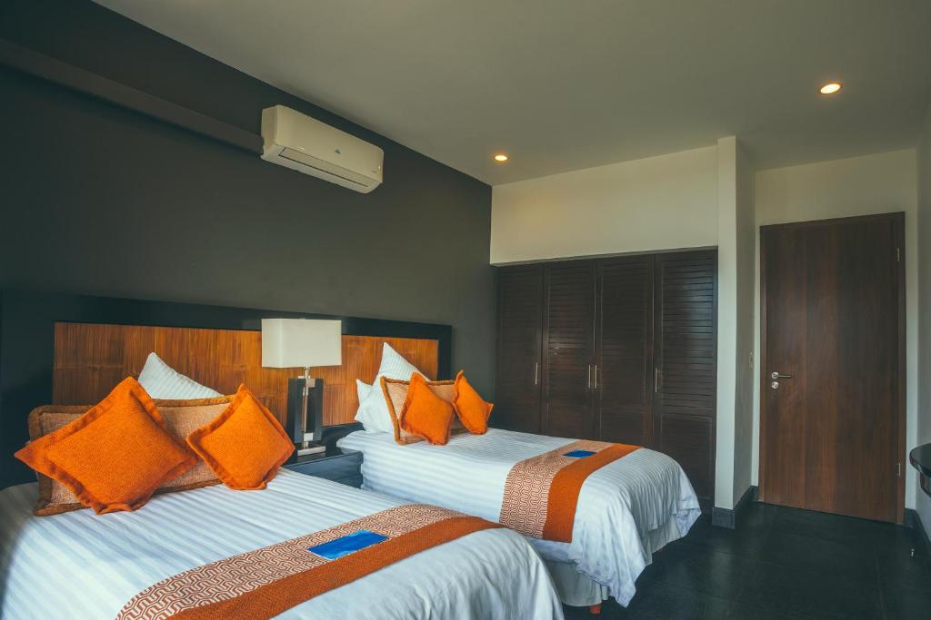 Postel nebo postele na pokoji v ubytování Los Altos Resort
